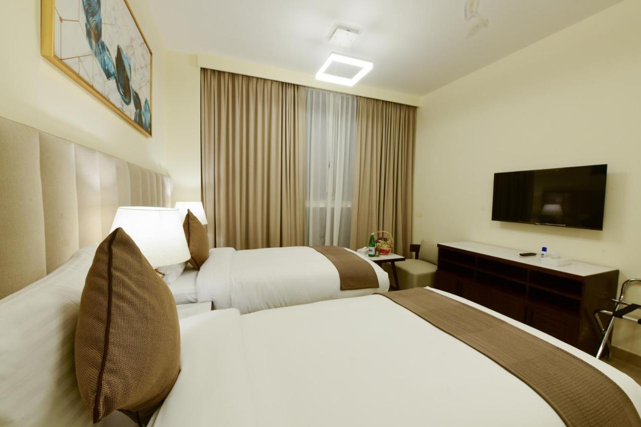 Saray Deluxe Hotel Apartments Abu Dhabi Buitenkant foto Deluxe Room