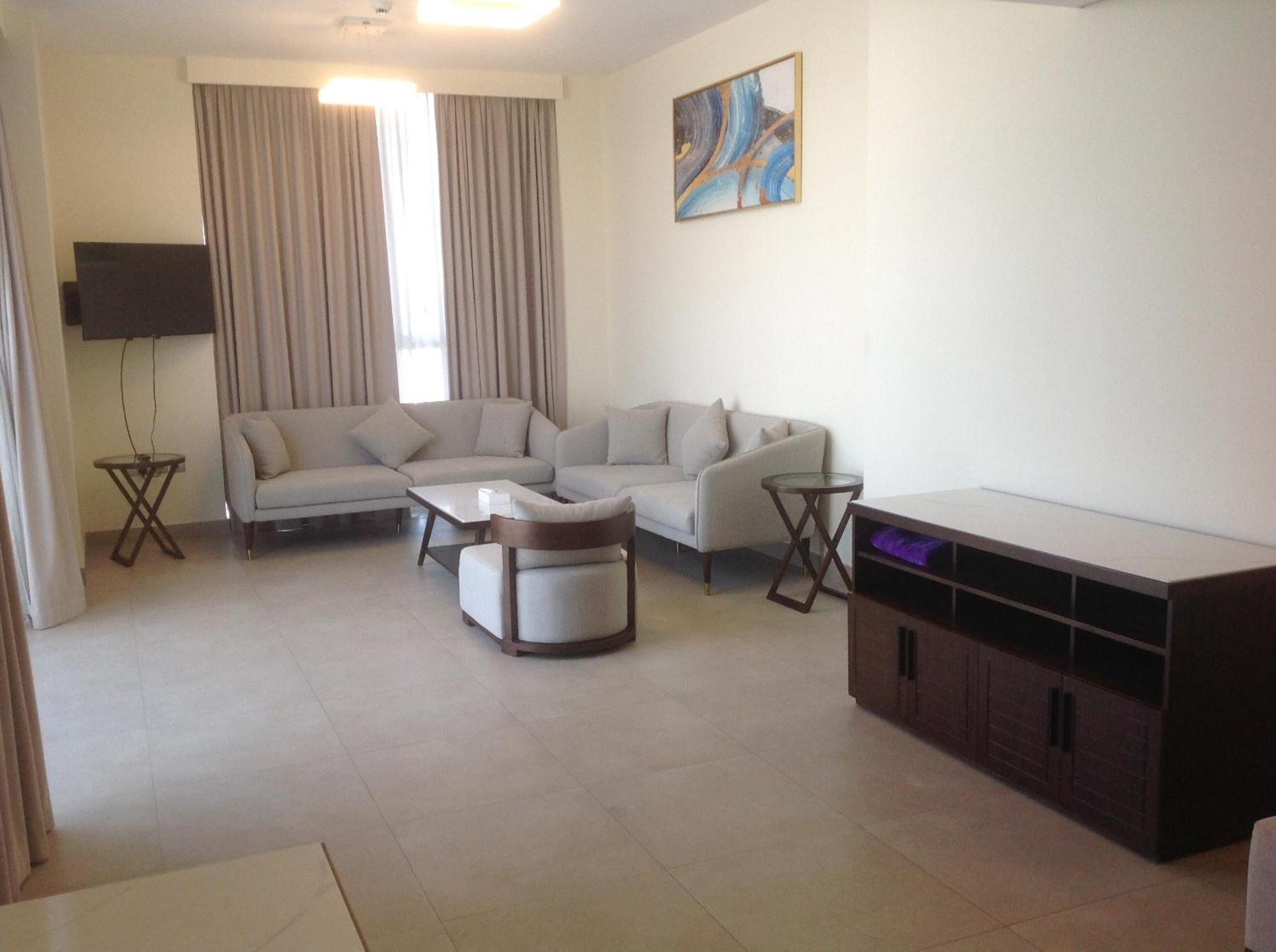 Saray Deluxe Hotel Apartments Abu Dhabi Buitenkant foto Living room